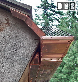 Custom copper wedge to mount gutters on diagonal boards